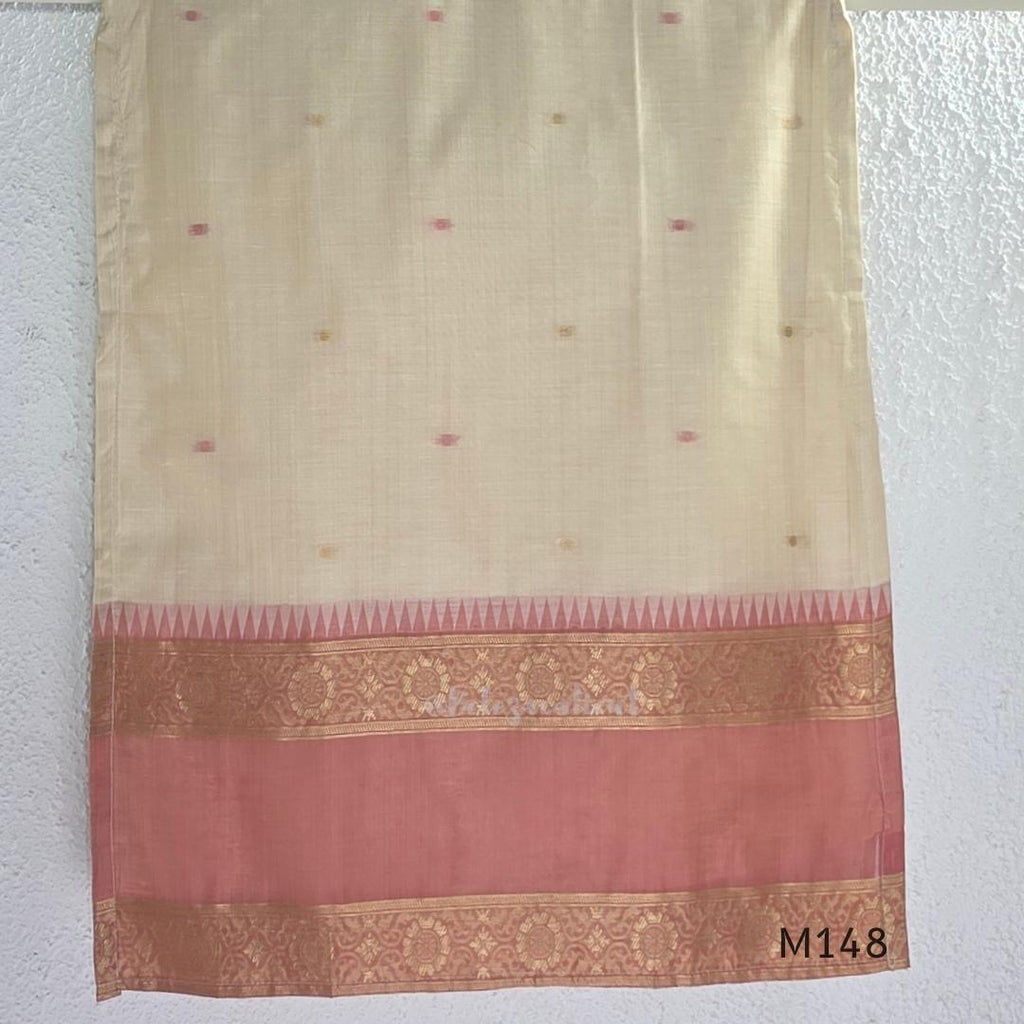 Rose pink and ivory tissue blend churidar set with woven gold borders, scattered motifs, straight bottom and matching dupatta.