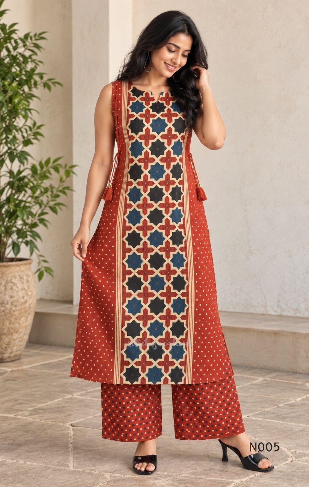 Warm rust cotton top and bottom set with cream, deep blue and black geometric print and relaxed wide-fit pants at Beleza, Mankavu, Calicut.