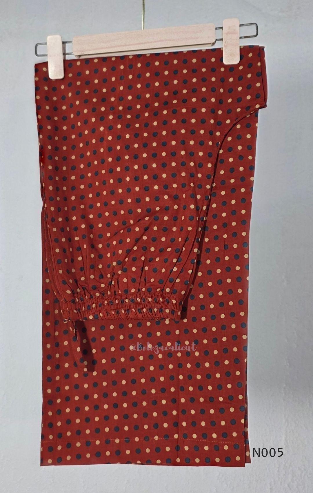 Warm rust cotton top and bottom set with cream, deep blue and black geometric print and relaxed wide-fit pants at Beleza, Mankavu, Calicut.