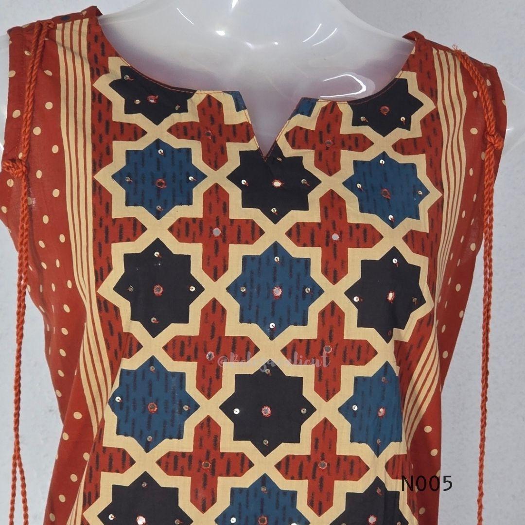 Warm rust cotton top and bottom set with cream, deep blue and black geometric print and relaxed wide-fit pants at Beleza, Mankavu, Calicut.