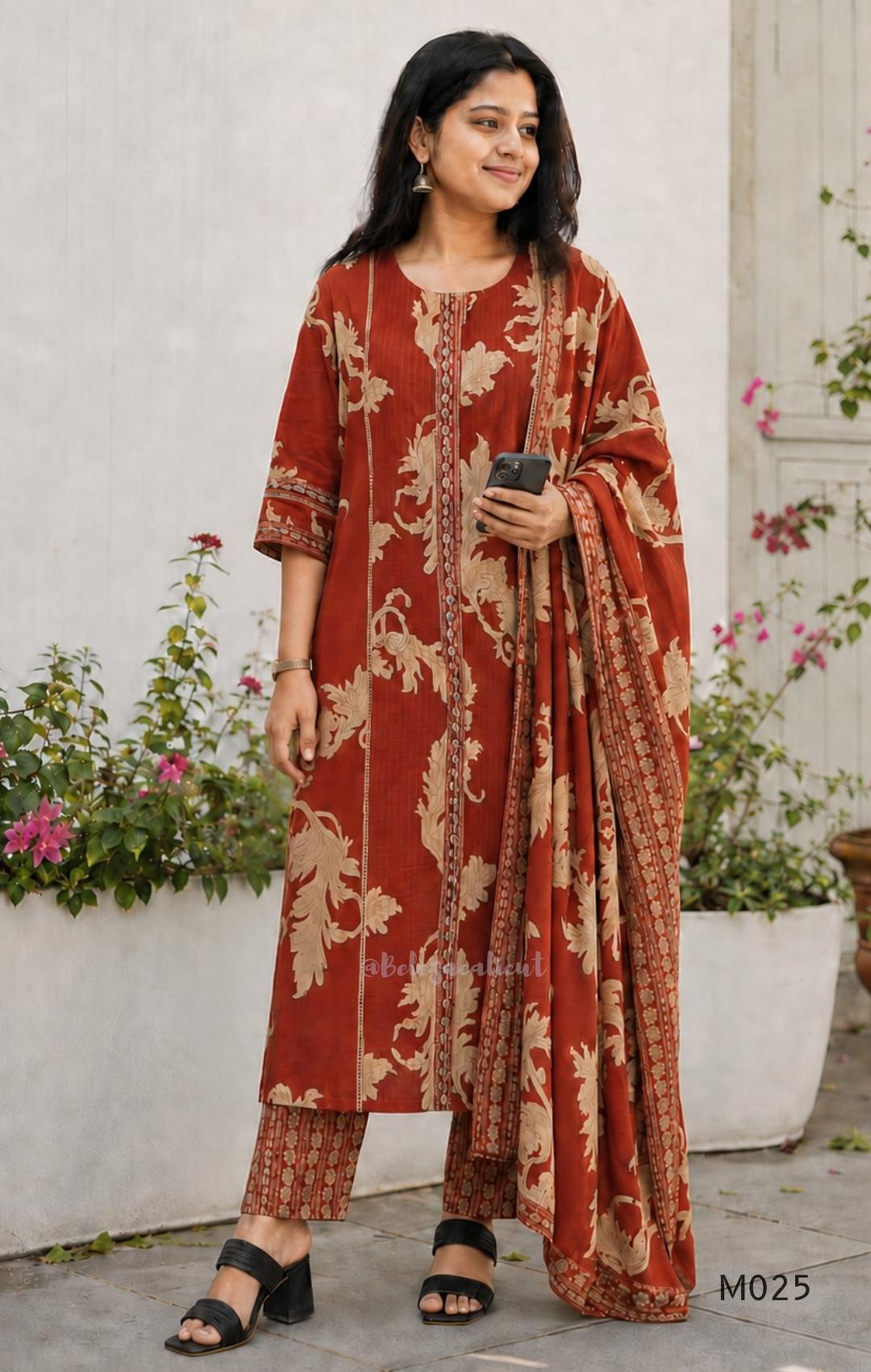 Rust cotton 3-piece ethnic set with beige leaf print, matching dupatta and printed pant. Comfortable ethnic wear for women in Calicut.