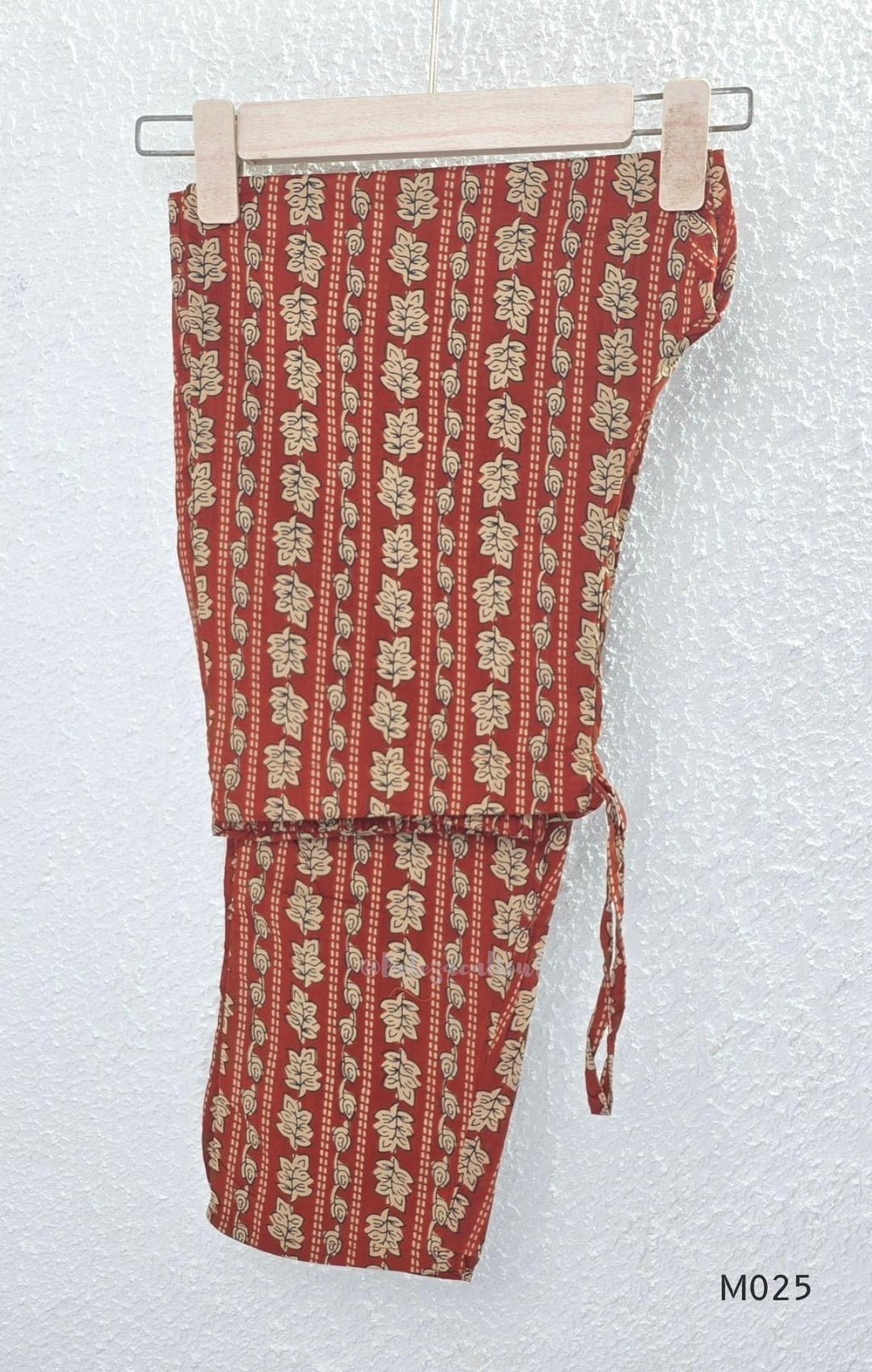 Rust cotton 3-piece ethnic set with beige leaf print, matching dupatta and printed pant. Comfortable ethnic wear for women in Calicut.