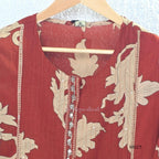 Rust cotton 3-piece ethnic set with beige leaf print, matching dupatta and printed pant. Comfortable ethnic wear for women in Calicut.