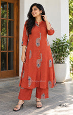 Rust-orange cotton co-ord set with dotted paisley print, A-line top and straight wide-leg bottom.