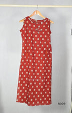 Rust red cotton 2-piece co-ord set with cream and navy motifs, mirror neckline detail and relaxed wide-fit pants.