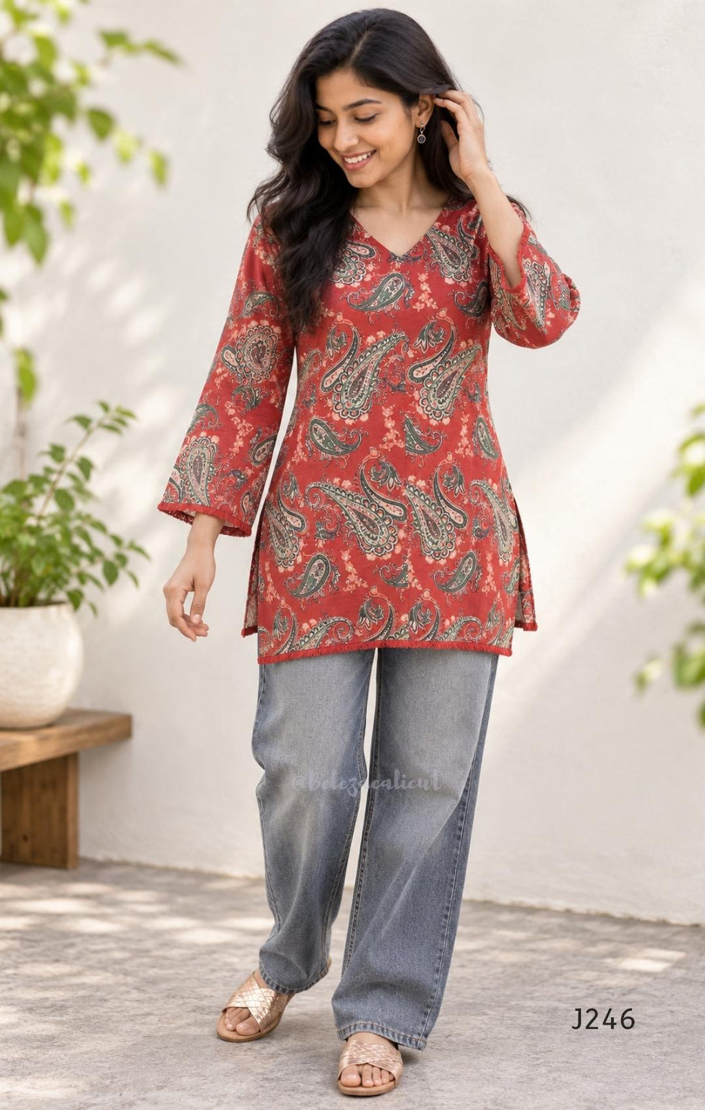 Rust red cotton short top with green and cream paisley print, sold as a top only.