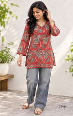 Rust red cotton short top with green and cream paisley print, sold as a top only.