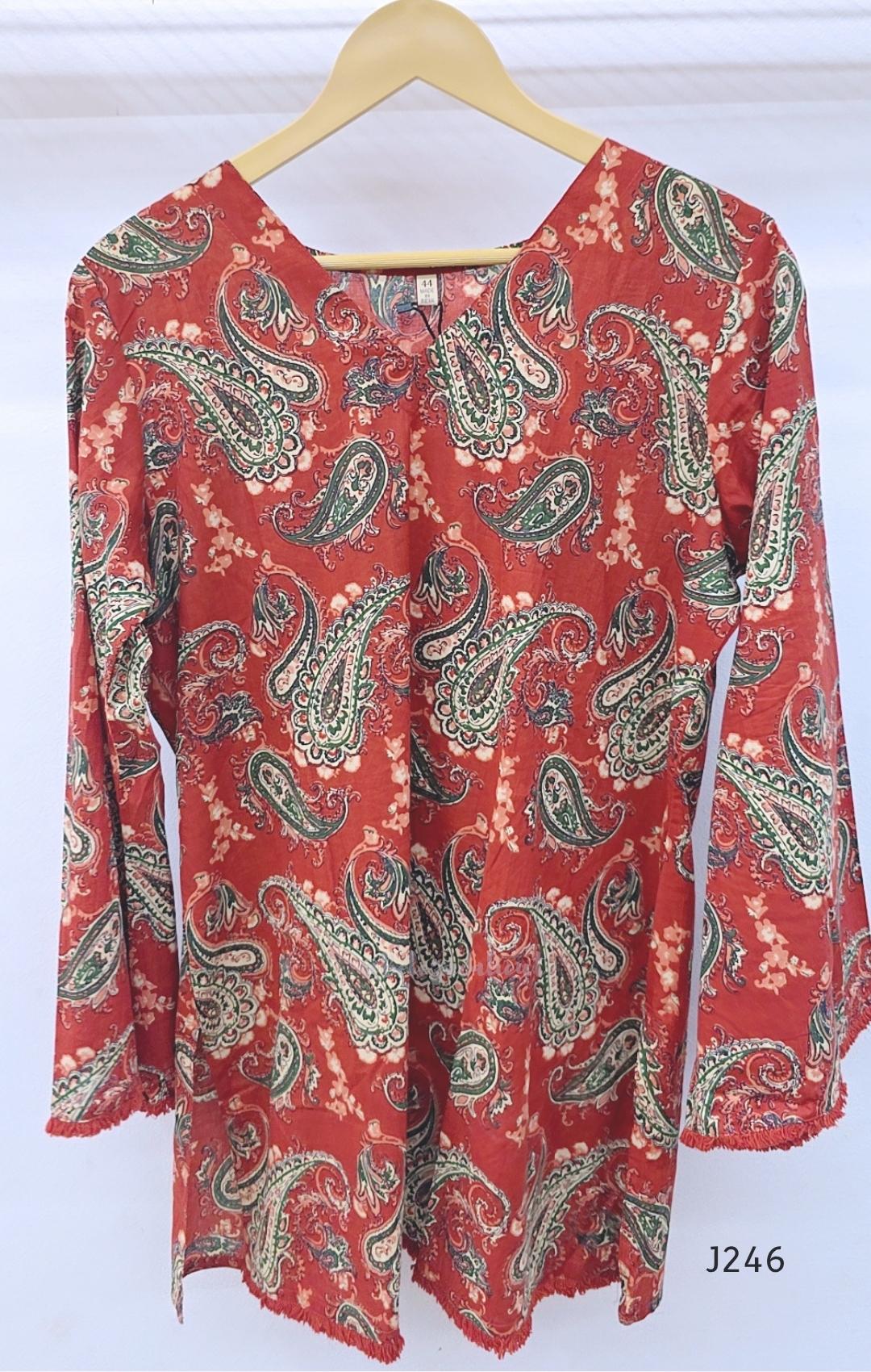 Rust red cotton short top with green and cream paisley print, sold as a top only.