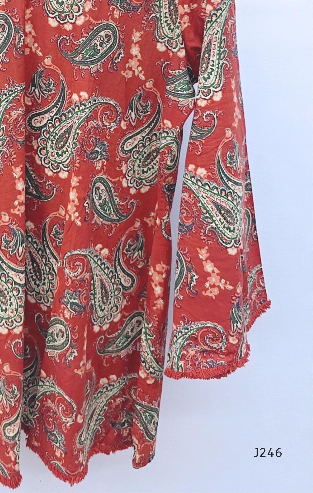 Rust red cotton short top with green and cream paisley print, sold as a top only.