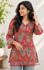 Rust red cotton short top with green and cream paisley print, sold as a top only.