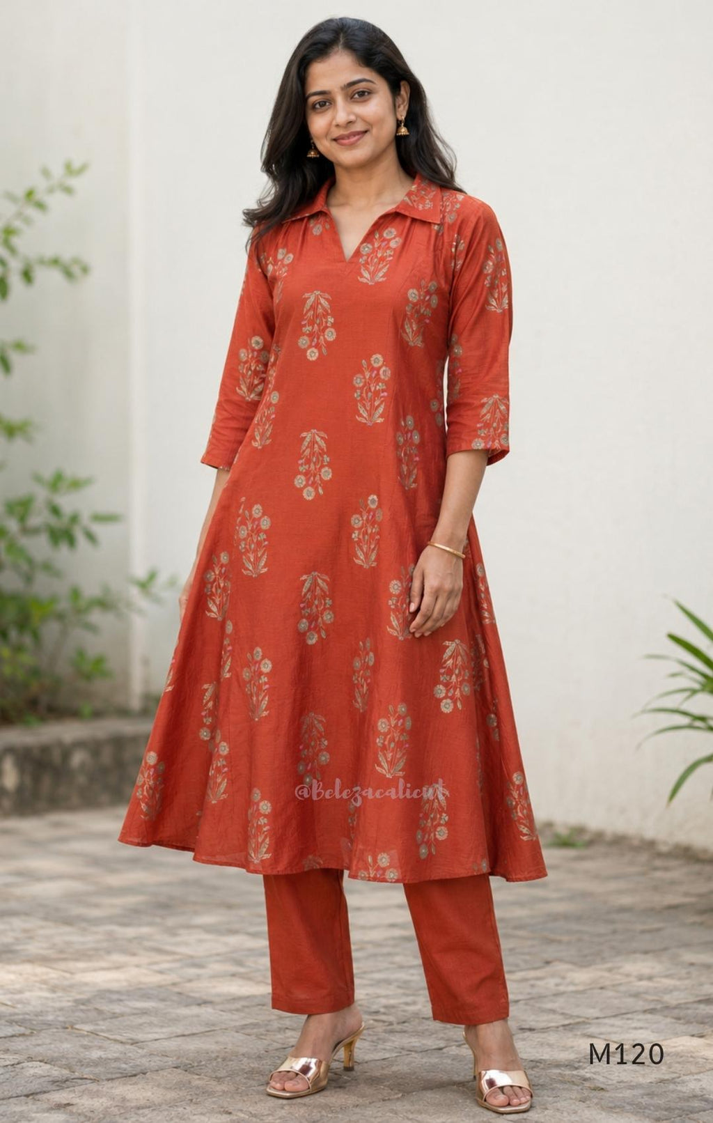Warm rust silk blend co-ord set with a flared mid-calf floral kurta, shirt-style collar neckline and matching plain bottom.