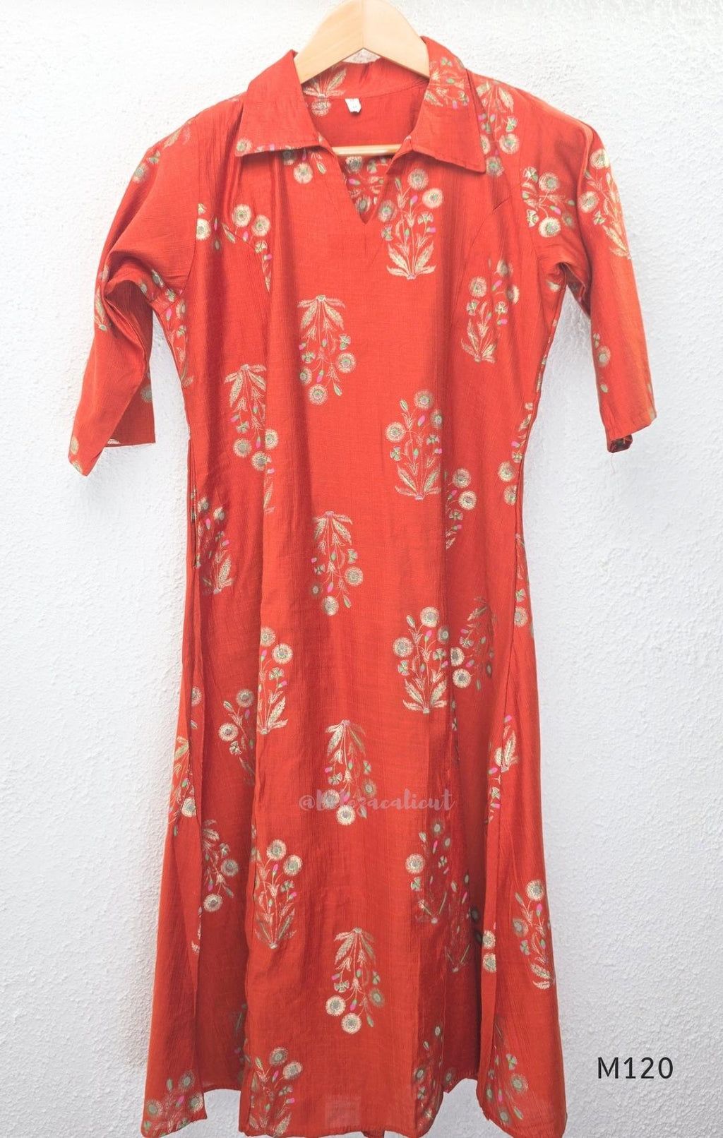 Warm rust silk blend co-ord set with a flared mid-calf floral kurta, shirt-style collar neckline and matching plain bottom.