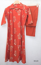 Warm rust silk blend co-ord set with a flared mid-calf floral kurta, shirt-style collar neckline and matching plain bottom.