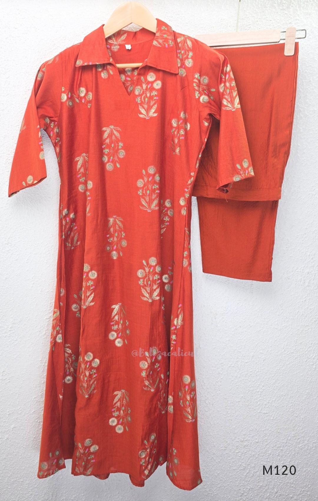 Warm rust silk blend co-ord set with a flared mid-calf floral kurta, shirt-style collar neckline and matching plain bottom.