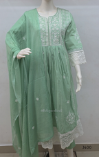 Sage green cotton churidar set with lining, white embroidery, lace border and matching dupatta. Available at Beleza Calicut