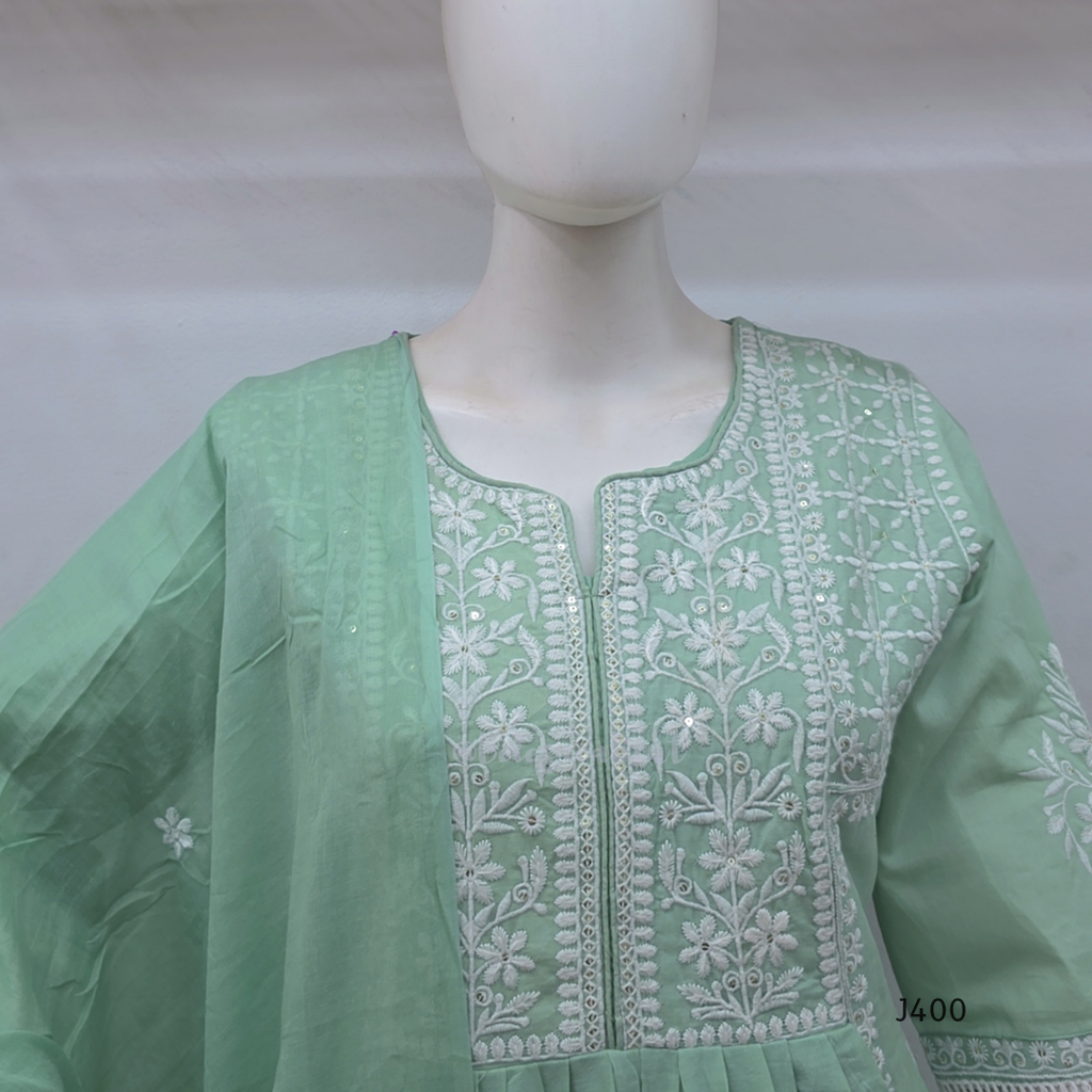 Sage green cotton churidar set with lining, white embroidery, lace border and matching dupatta. Available at Beleza Calicut