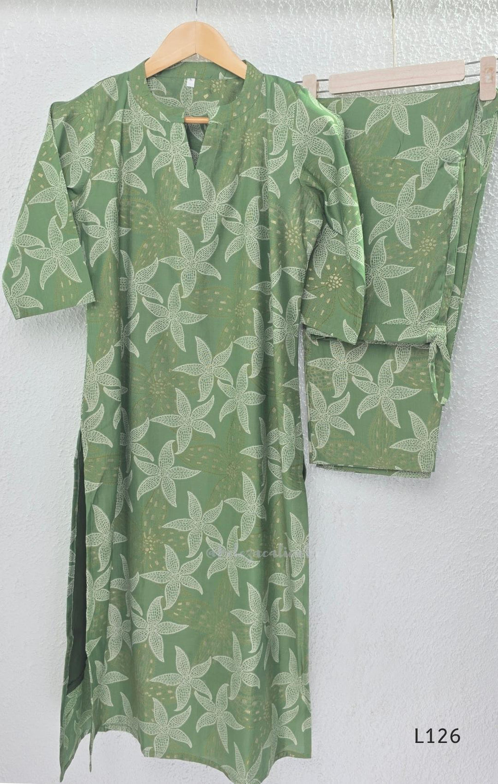Sage green silk blend top and bottom coord set with cream floral print and gold-toned detailing.