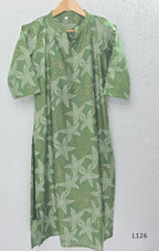 Sage green silk blend top and bottom coord set with cream floral print and gold-toned detailing.