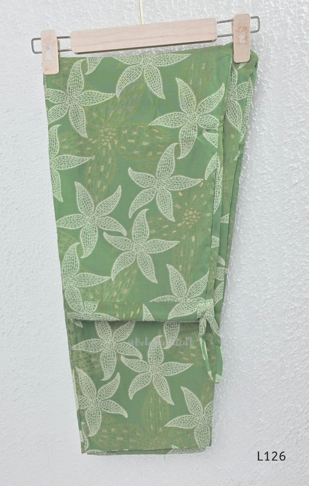 Sage green silk blend top and bottom coord set with cream floral print and gold-toned detailing.