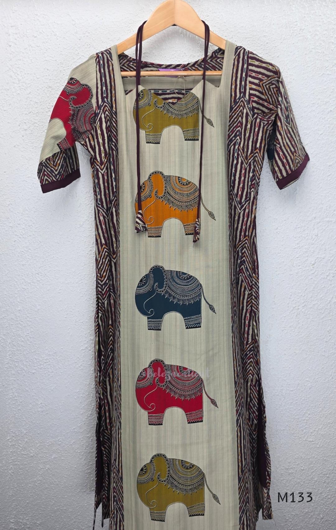 Sand beige silk blend long kurta with multicolour elephant motifs, maroon chevron side panels and contrast half sleeves.