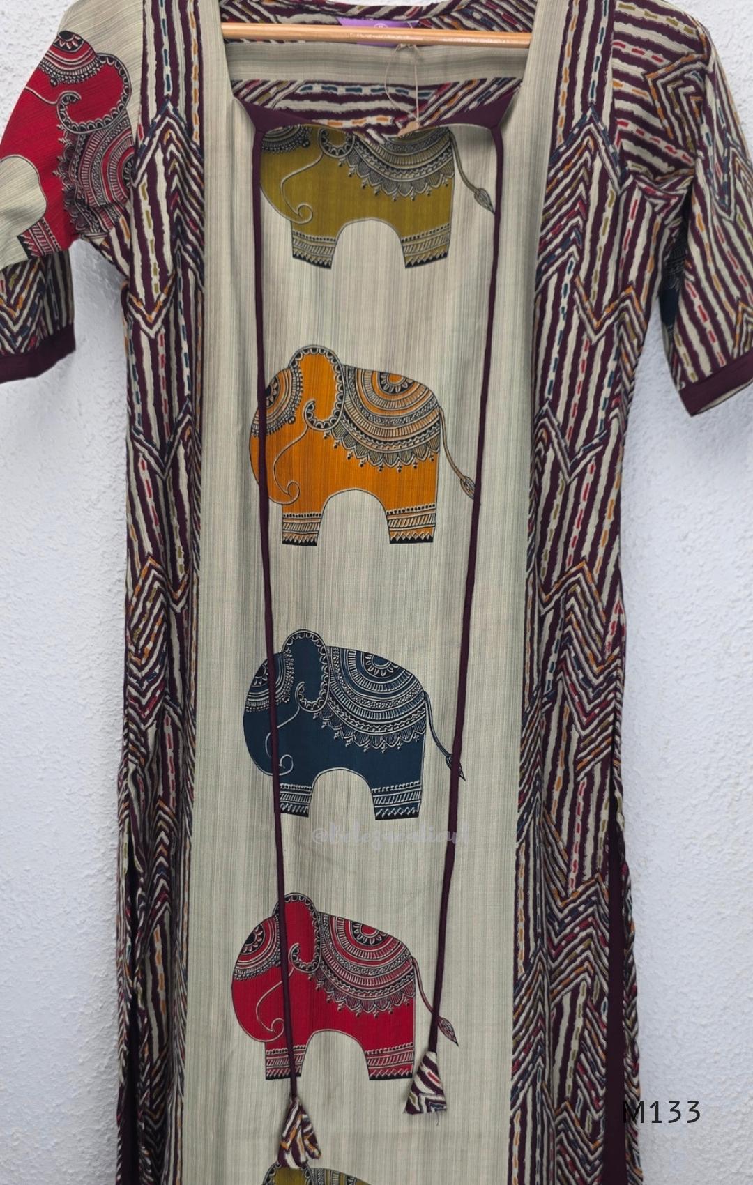 Sand beige silk blend long kurta with multicolour elephant motifs, maroon chevron side panels and contrast half sleeves.