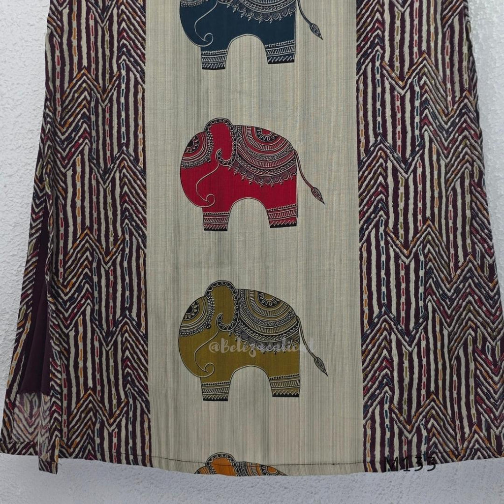 Sand beige silk blend long kurta with multicolour elephant motifs, maroon chevron side panels and contrast half sleeves.