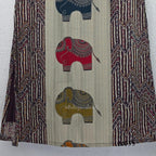 Sand beige silk blend long kurta with multicolour elephant motifs, maroon chevron side panels and contrast half sleeves.