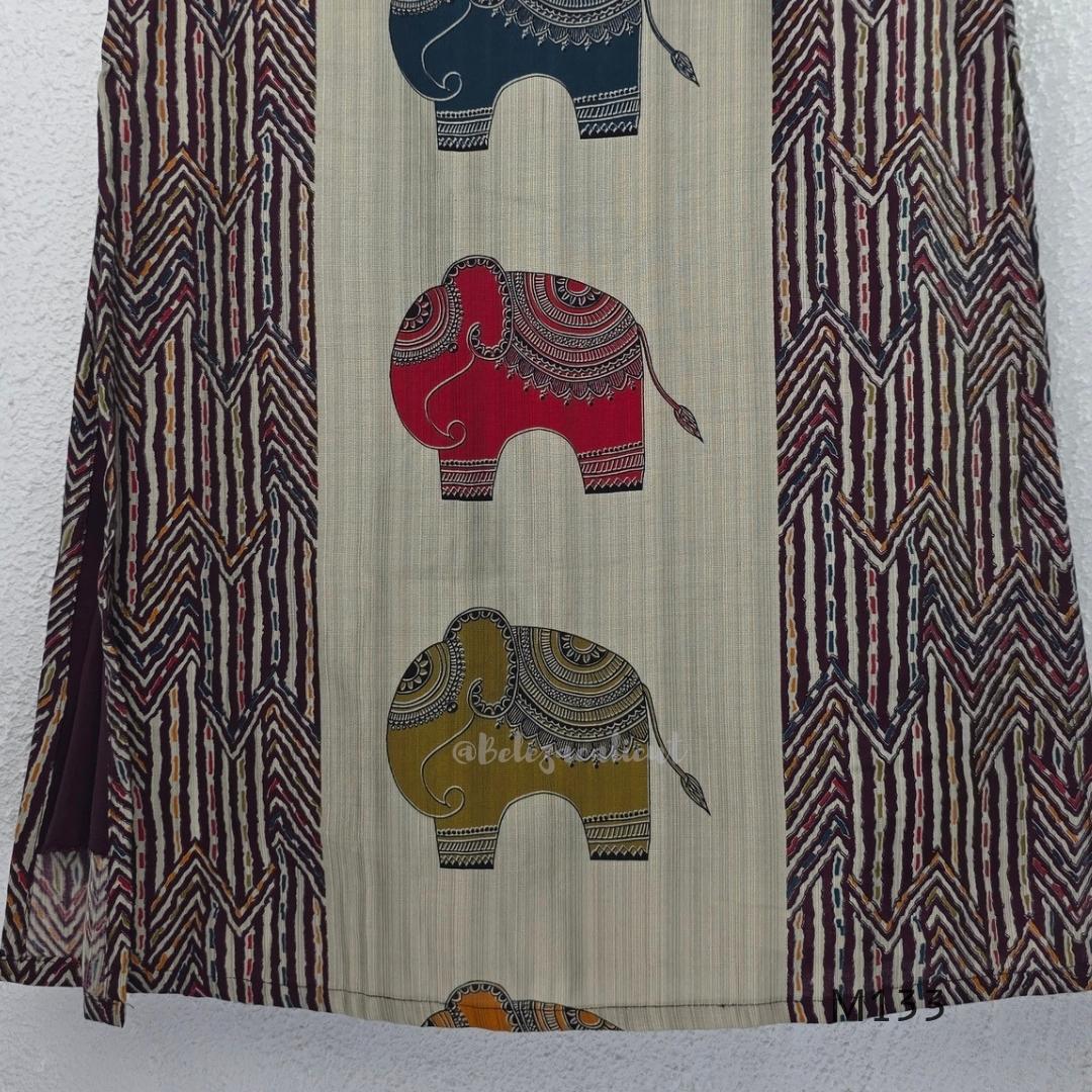 Sand beige silk blend long kurta with multicolour elephant motifs, maroon chevron side panels and contrast half sleeves.
