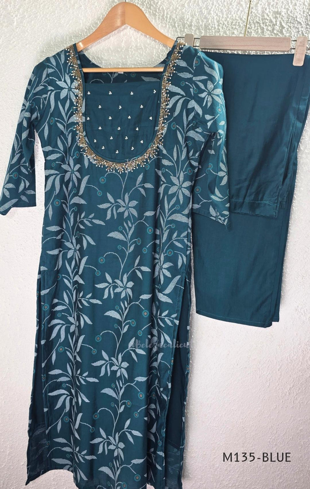 Silk blend 2-piece set with botanical printed straight kurta, embellished deep neckline, three-quarter sleeves and matching plain bottom.