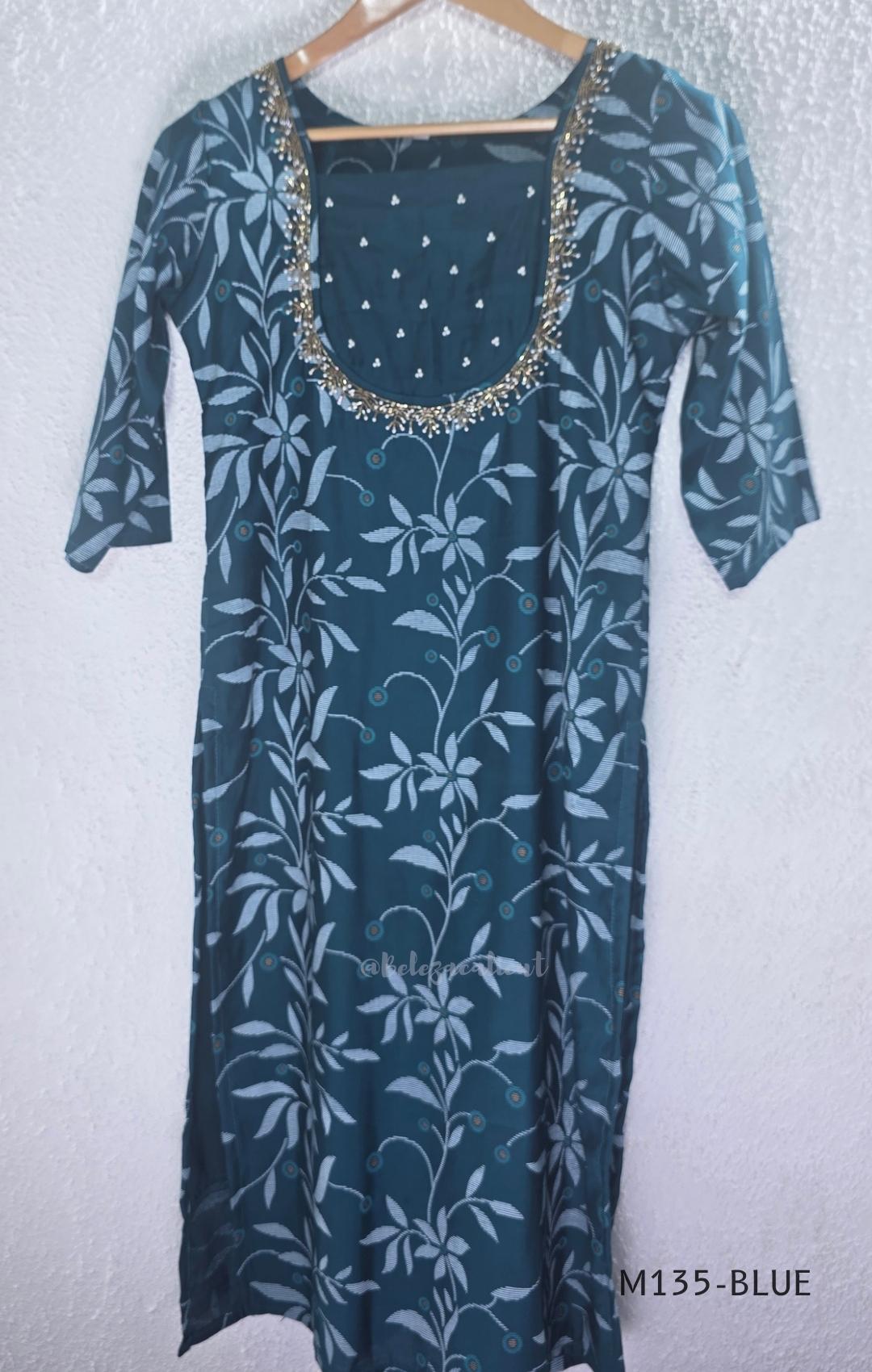 Silk blend 2-piece set with botanical printed straight kurta, embellished deep neckline, three-quarter sleeves and matching plain bottom.