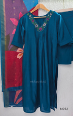 Silk blend 3-piece churidar set in teal, rani pink and rust shades with floral V-neck embroidery, printed dupatta and straight pant.