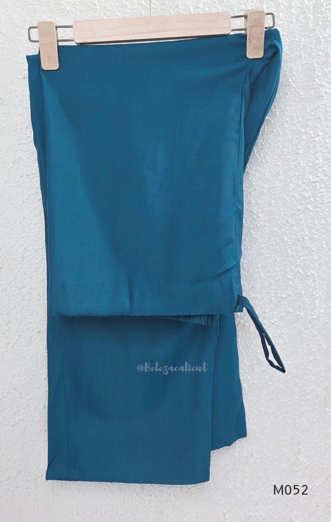 Silk blend 3-piece churidar set in teal, rani pink and rust shades with floral V-neck embroidery, printed dupatta and straight pant.