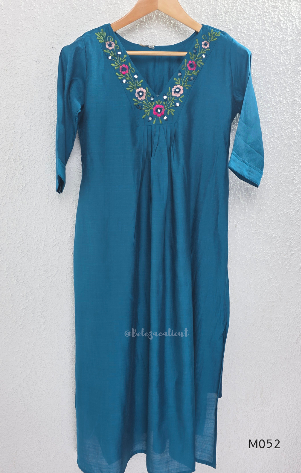 Silk blend 3-piece churidar set in teal, rani pink and rust shades with floral V-neck embroidery, printed dupatta and straight pant.