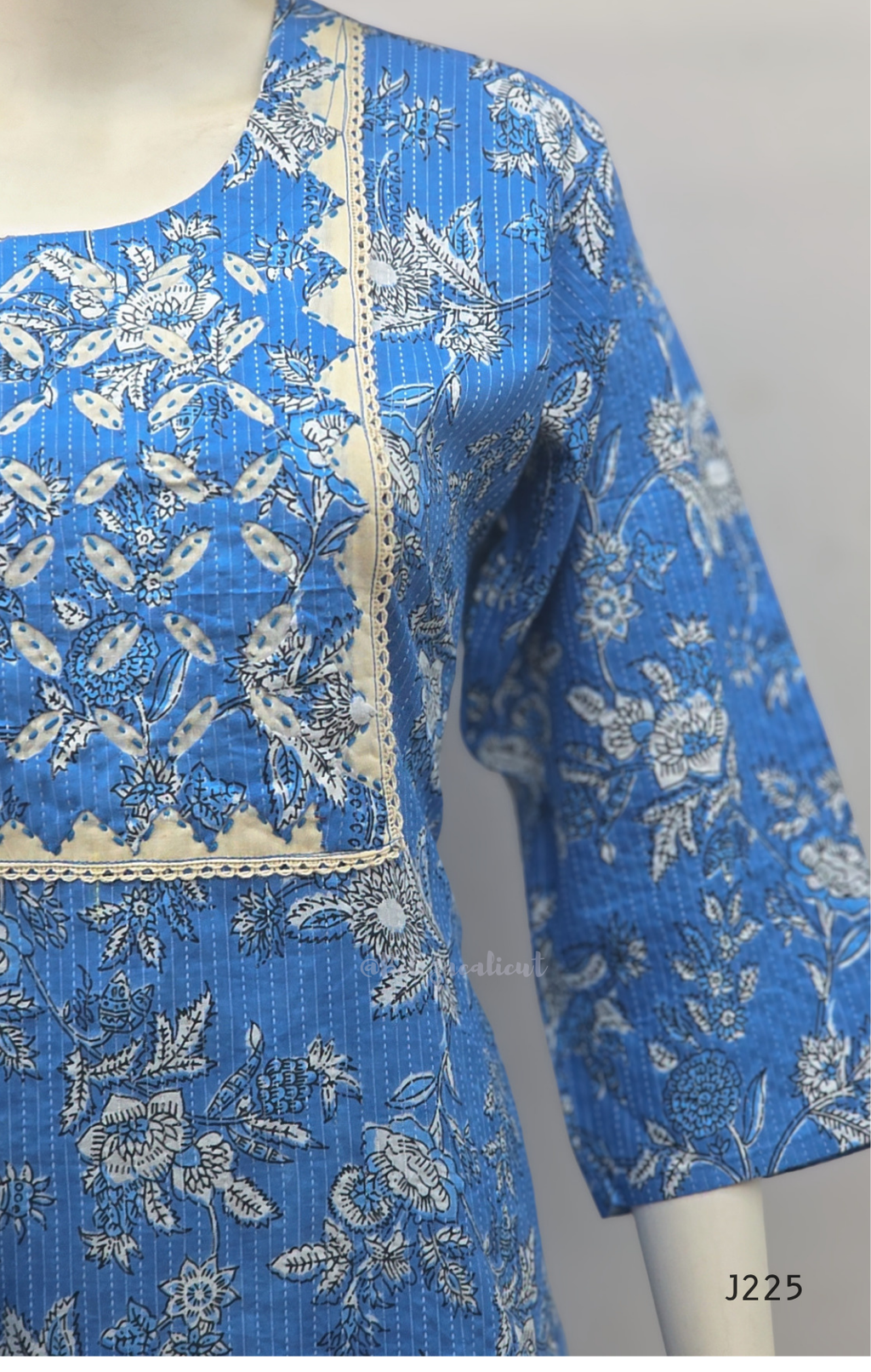 Sky blue premium kantha cotton churidar set with white floral print, applique yoke and cotton dupatta. Available at Beleza Calicut.