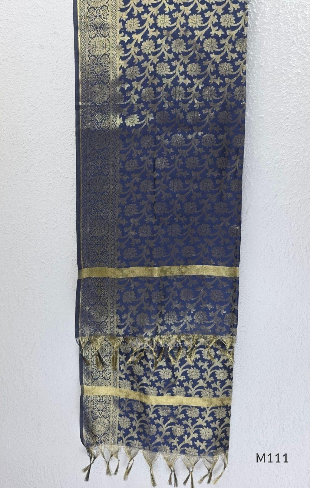 Soft gold tissue silk blend 3-piece set with gold front embroidery, matching bottom and deep navy antique gold zari dupatta.