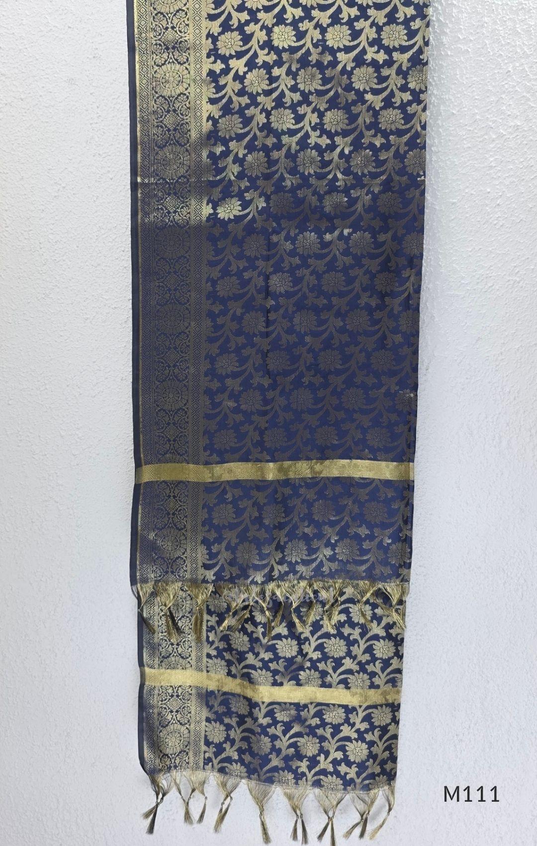Soft gold tissue silk blend 3-piece set with gold front embroidery, matching bottom and deep navy antique gold zari dupatta.