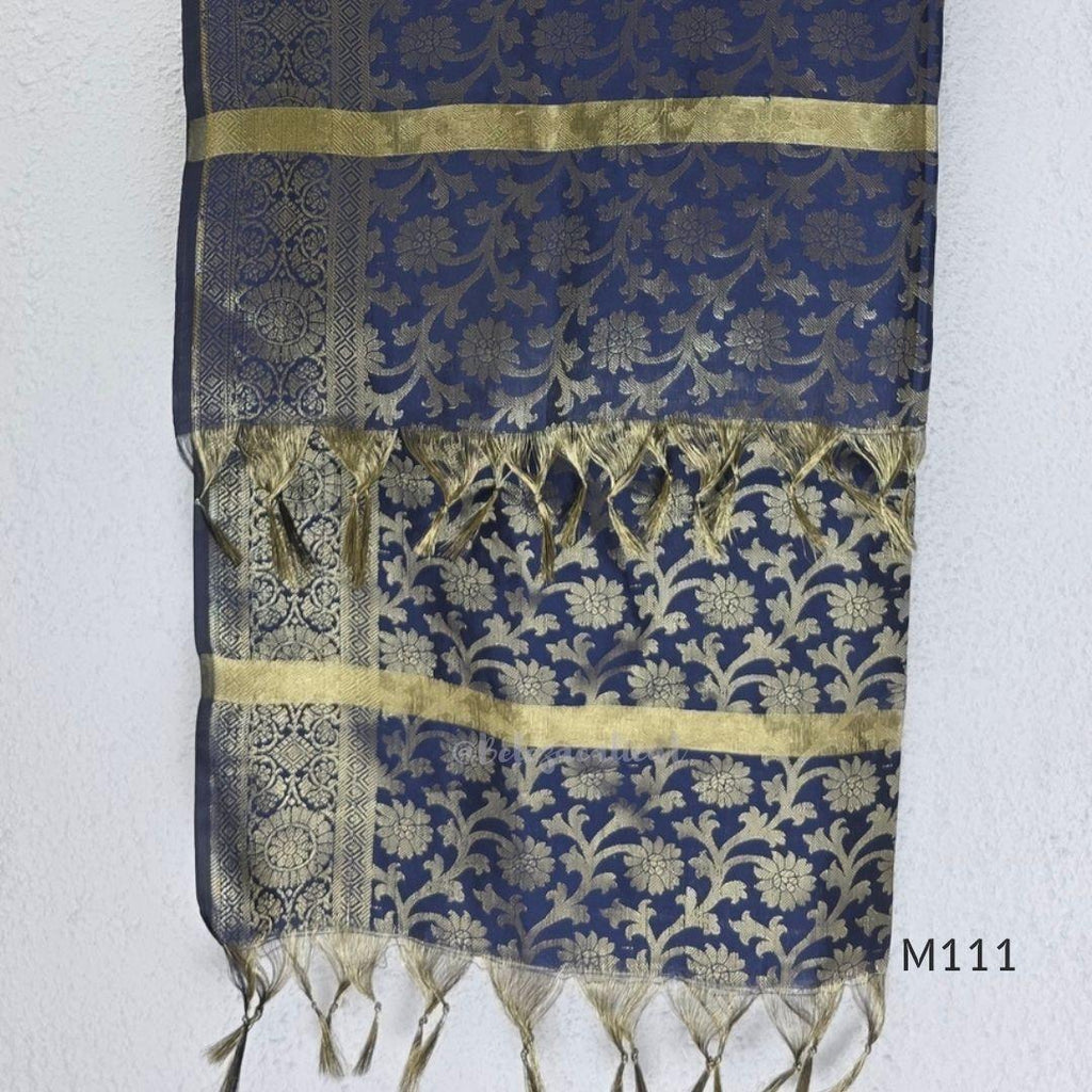 Soft gold tissue silk blend 3-piece set with gold front embroidery, matching bottom and deep navy antique gold zari dupatta.