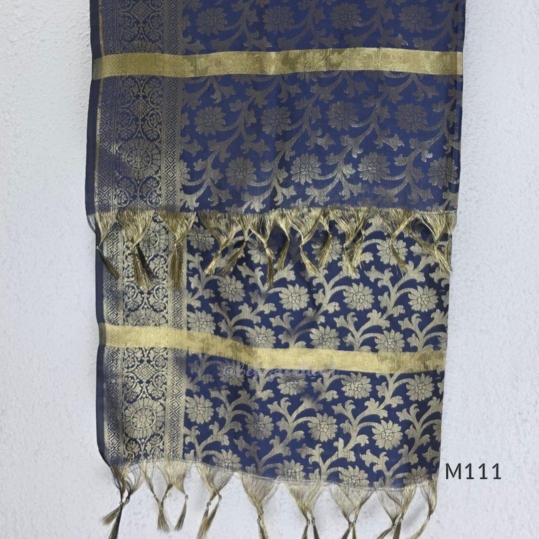Soft gold tissue silk blend 3-piece set with gold front embroidery, matching bottom and deep navy antique gold zari dupatta.
