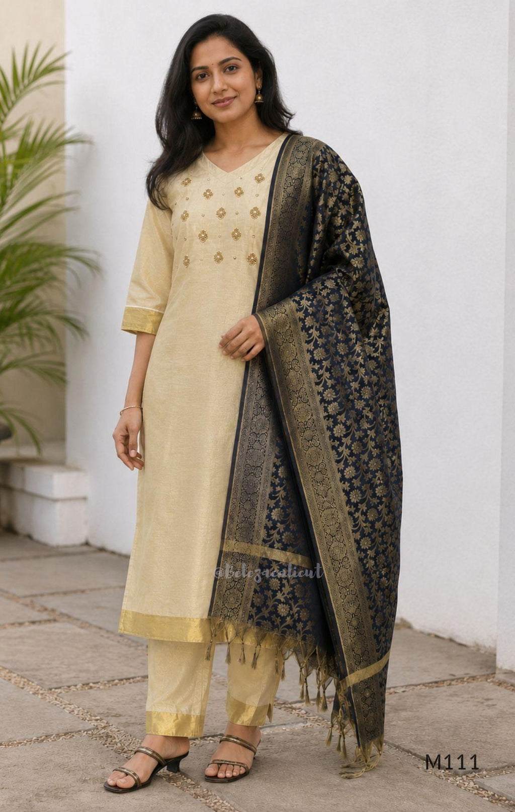 Soft gold tissue silk blend 3-piece set with gold front embroidery, matching bottom and deep navy antique gold zari dupatta.