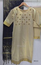 Soft gold tissue silk blend 3-piece set with gold front embroidery, matching bottom and deep navy antique gold zari dupatta.