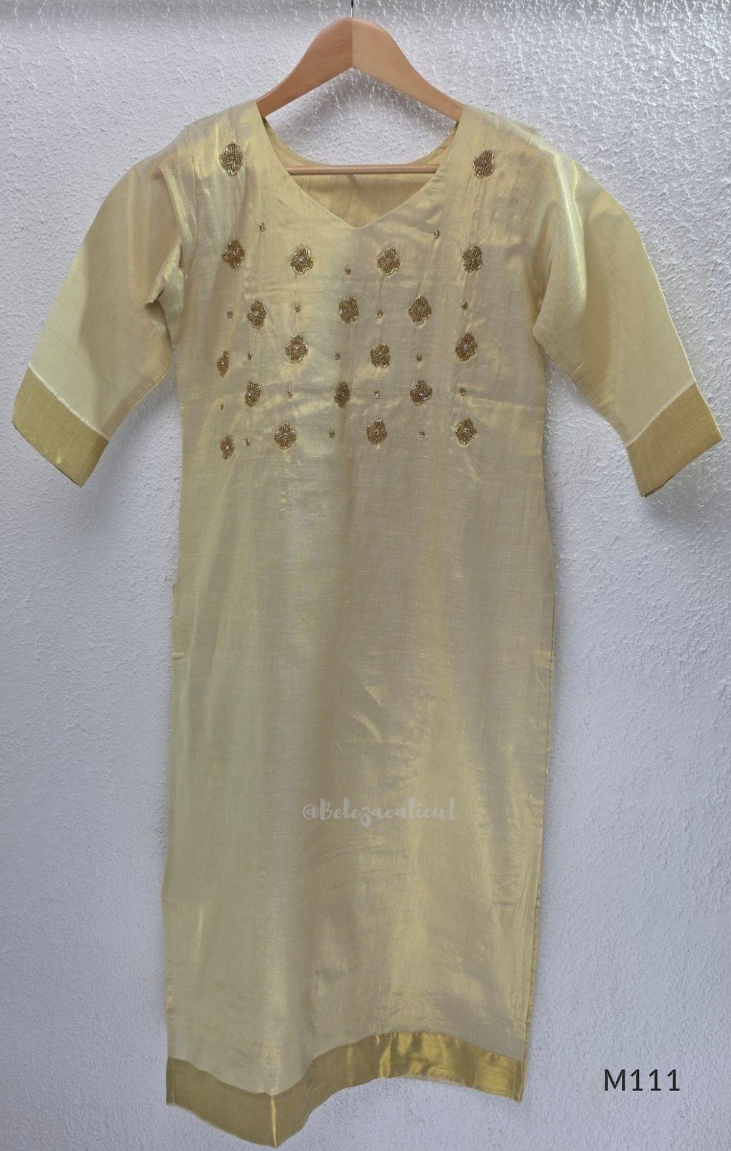 Soft gold tissue silk blend 3-piece set with gold front embroidery, matching bottom and deep navy antique gold zari dupatta.