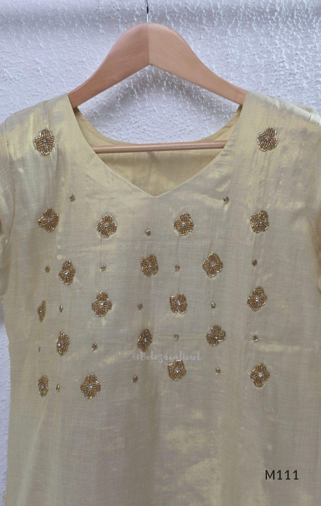 Soft gold tissue silk blend 3-piece set with gold front embroidery, matching bottom and deep navy antique gold zari dupatta.