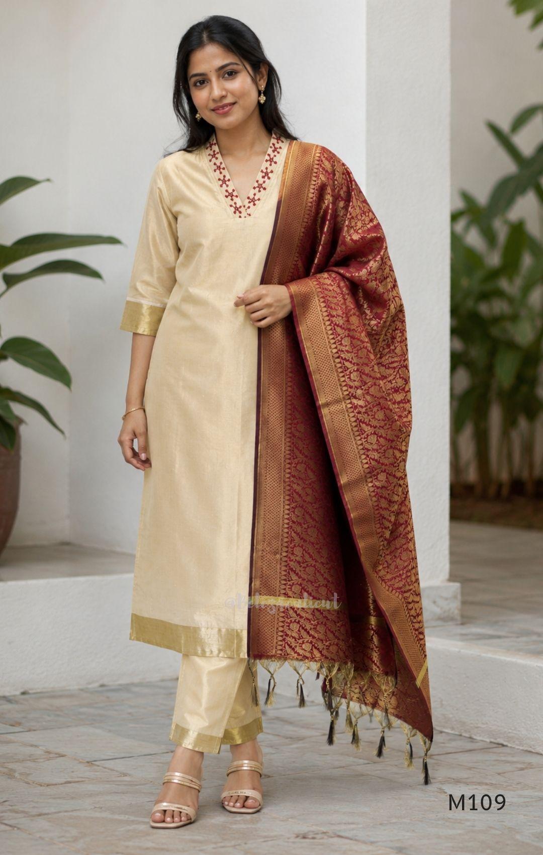 Soft gold tissue silk blend 3-piece set with red neckline bead work, matching bottom and deep maroon antique gold zari dupatta.