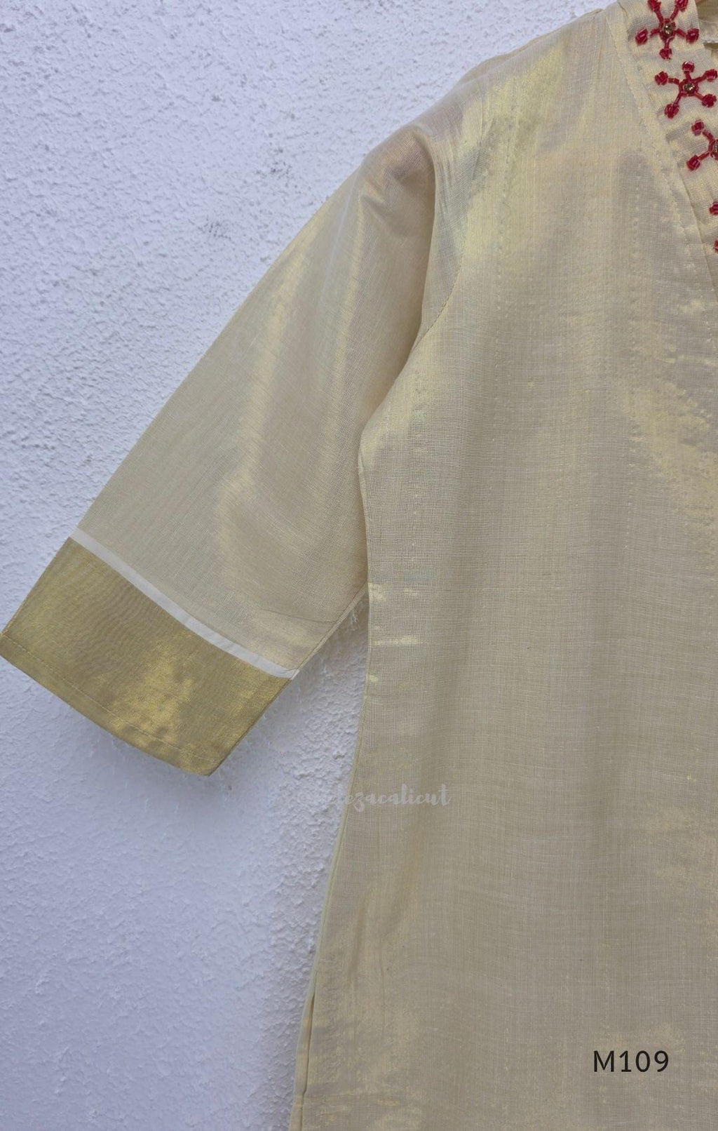 Soft gold tissue silk blend 3-piece set with red neckline bead work, matching bottom and deep maroon antique gold zari dupatta.