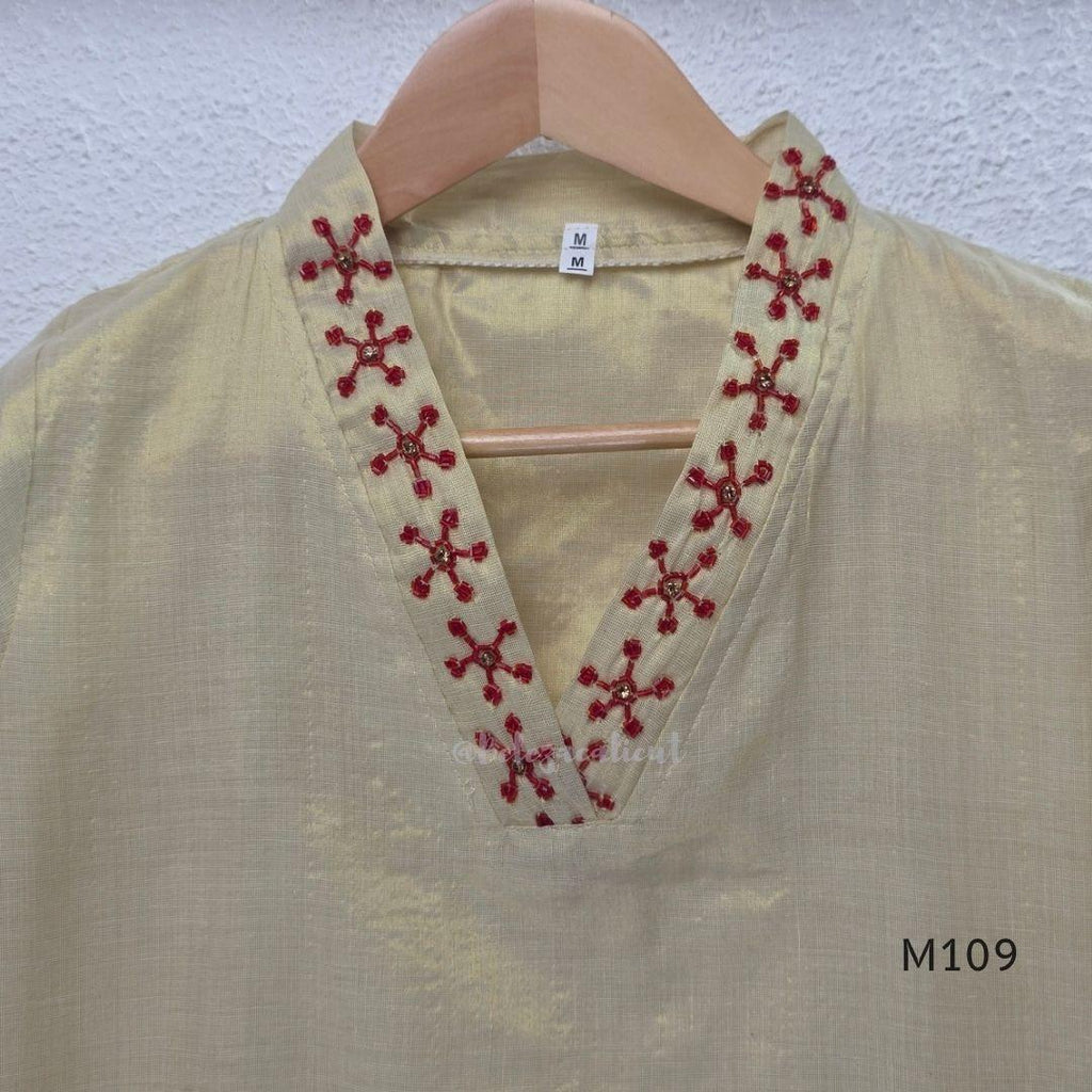 Soft gold tissue silk blend 3-piece set with red neckline bead work, matching bottom and deep maroon antique gold zari dupatta.