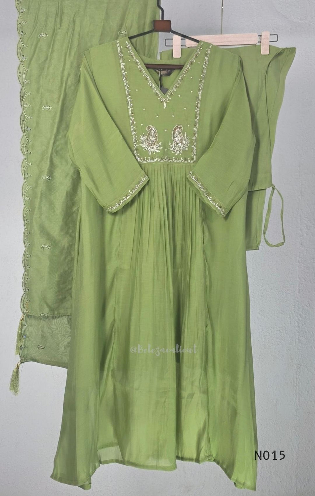 Soft olive green Mul Chanderi full churidar set with embroidered A-line kurta, straight-leg pants and matching embroidered dupatta.