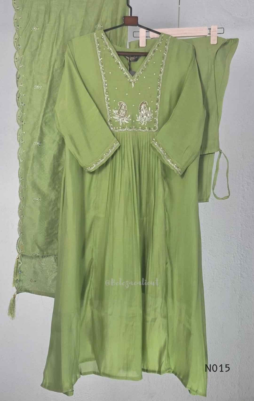 Soft olive green Mul Chanderi full churidar set with embroidered A-line kurta, straight-leg pants and matching embroidered dupatta.