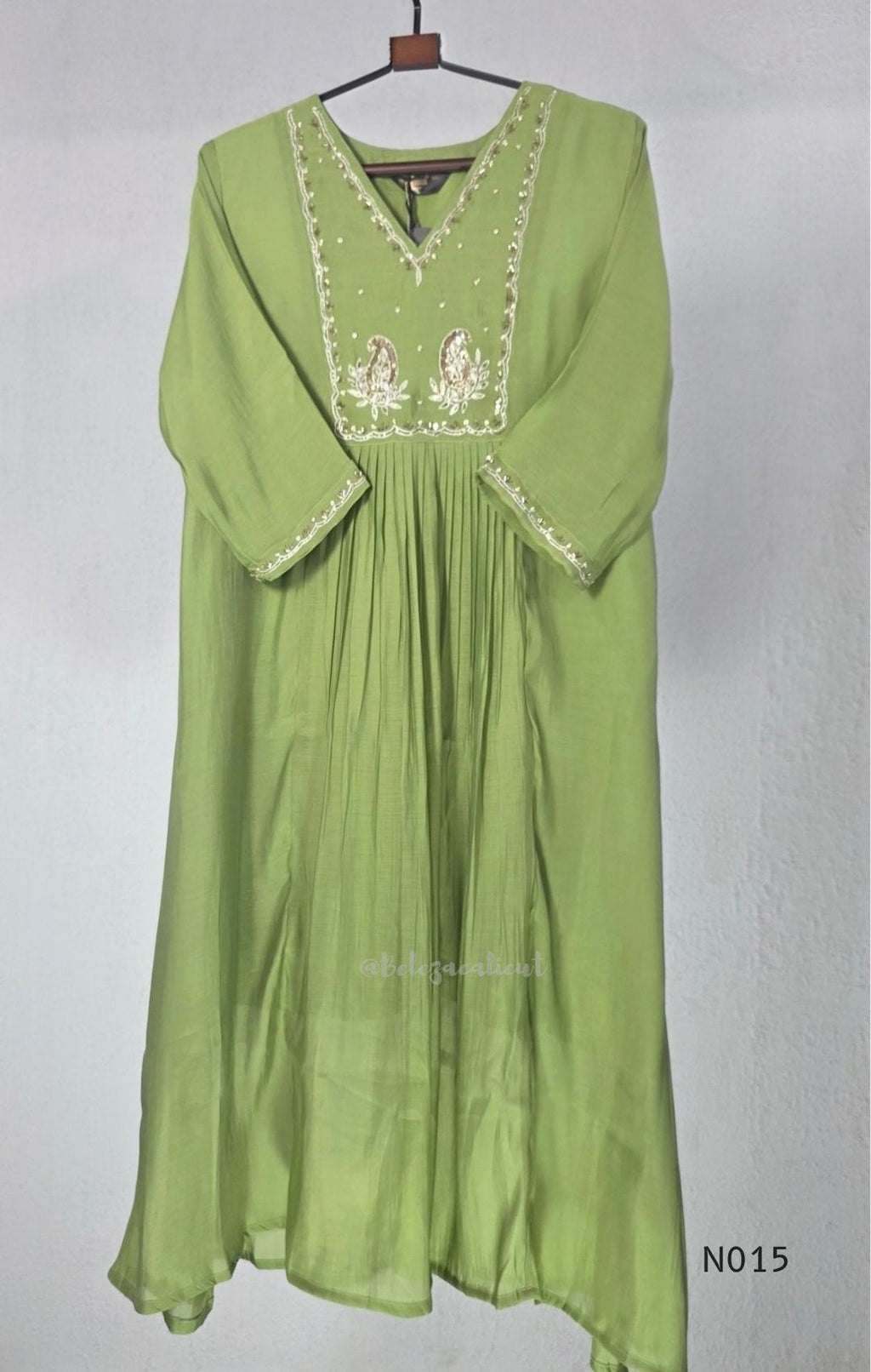 Soft olive green Mul Chanderi full churidar set with embroidered A-line kurta, straight-leg pants and matching embroidered dupatta.