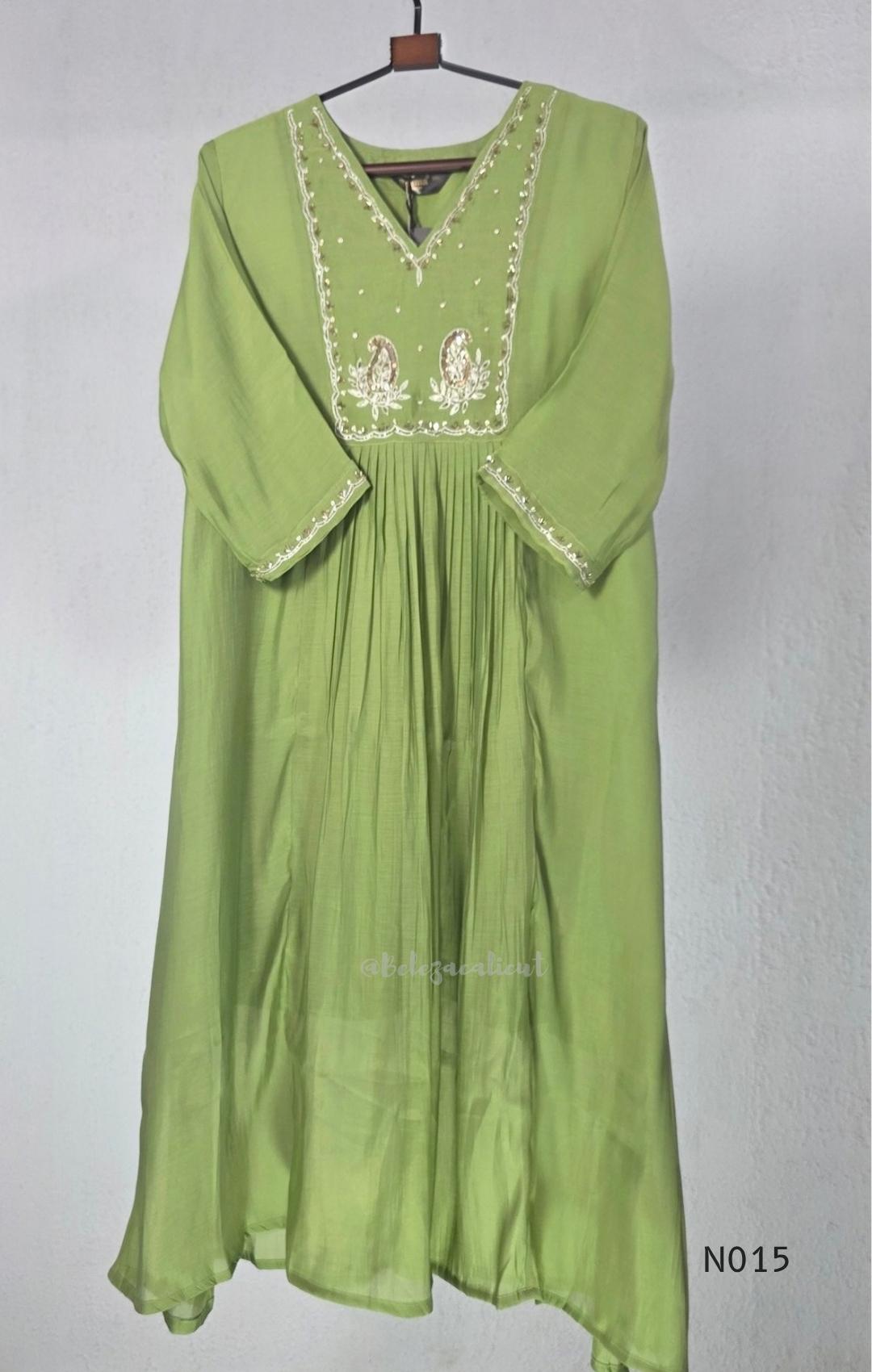 Soft olive green Mul Chanderi full churidar set with embroidered A-line kurta, straight-leg pants and matching embroidered dupatta.