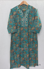 Teal blue Jaipur cotton churidar set with floral print, mirror-work neckline, matching printed bottom and dupatta.